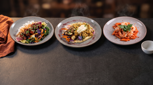 High protein dinner ideas: Protein Chefs Korean BBQ beef, chicken shawarma and chili garlic shrimp penne on a dark table